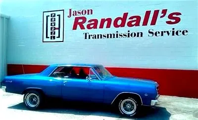 Jason Randall's Transmission Service shop on E 23rd St in Chattanooga, with the painted shop sign and a classic car out front